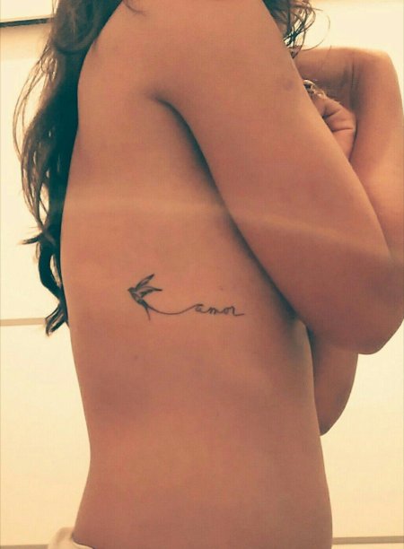 Тату на ребрах женские