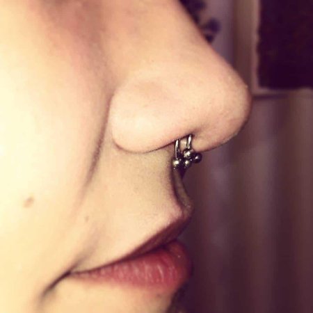 Прокол носа септум