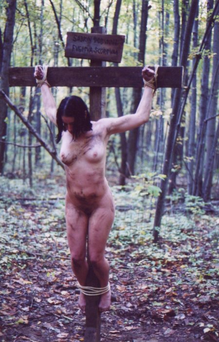 Outdoor bondage girl crucified nude on the wood