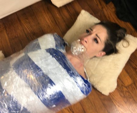 Связанные скотчем девушки